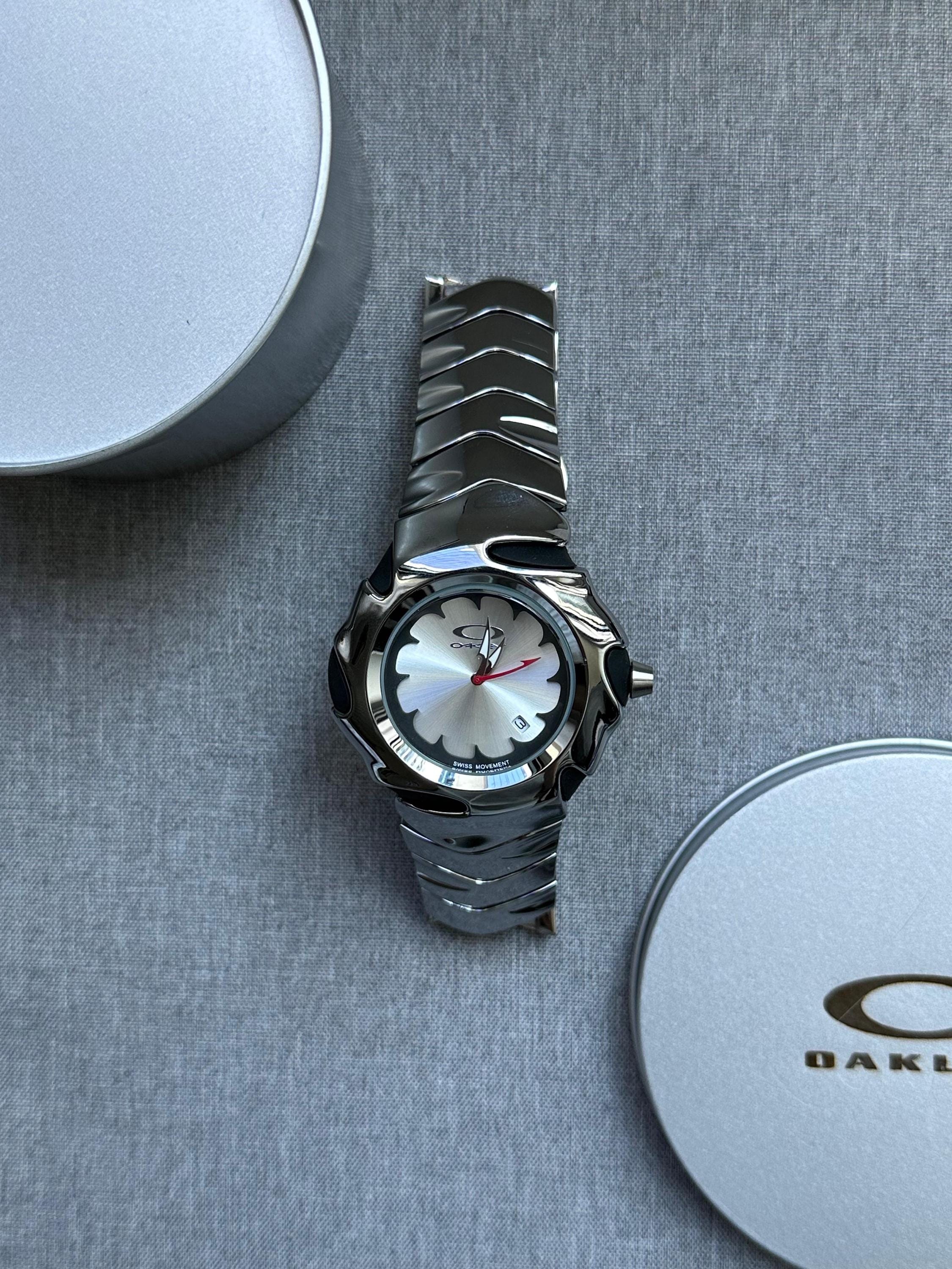 Oakley Blade Watch – White Dial Silver SHINY Stainless Steel with Smooth Reflective Strap, Swiss Movement, Collectible Men’s Watch
